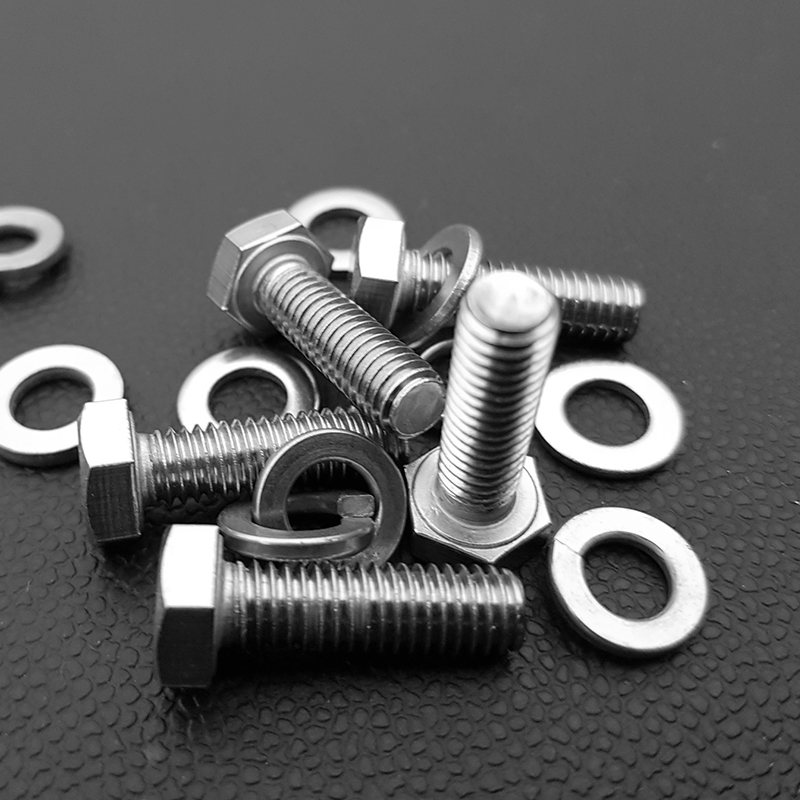 How do alloying elements such as chromium, nickel, and molybdenum affect the properties of steel fasteners?